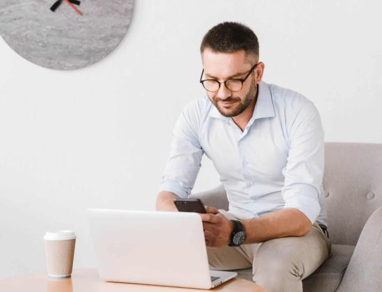 photo-of-business-man-wearing-eyeglasses-sitting-i-PB3SK4U-scaled.jpg